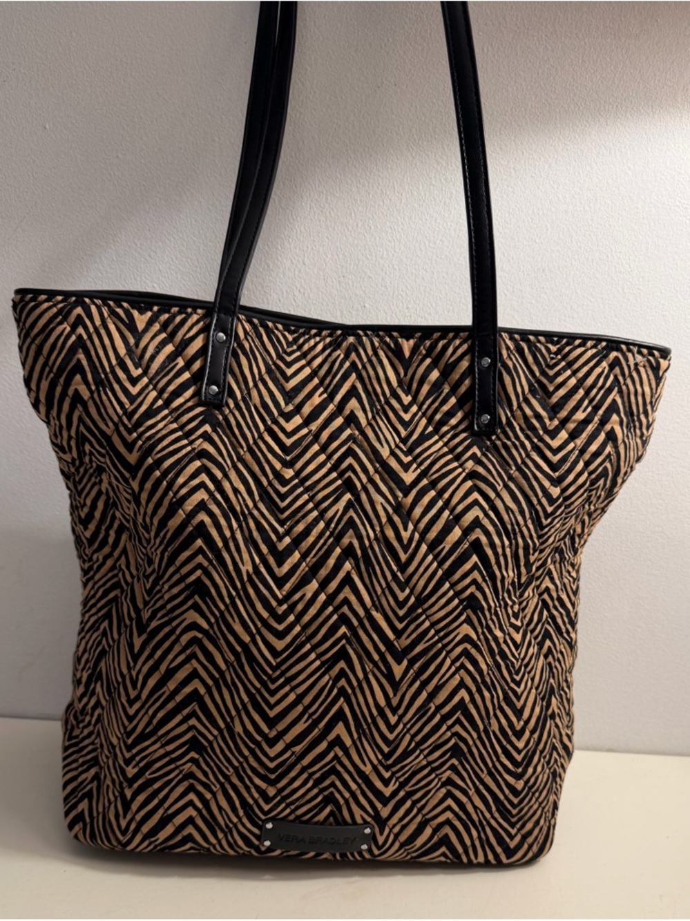Vera Bradley tote in zebra chevron pattern in black and tan.